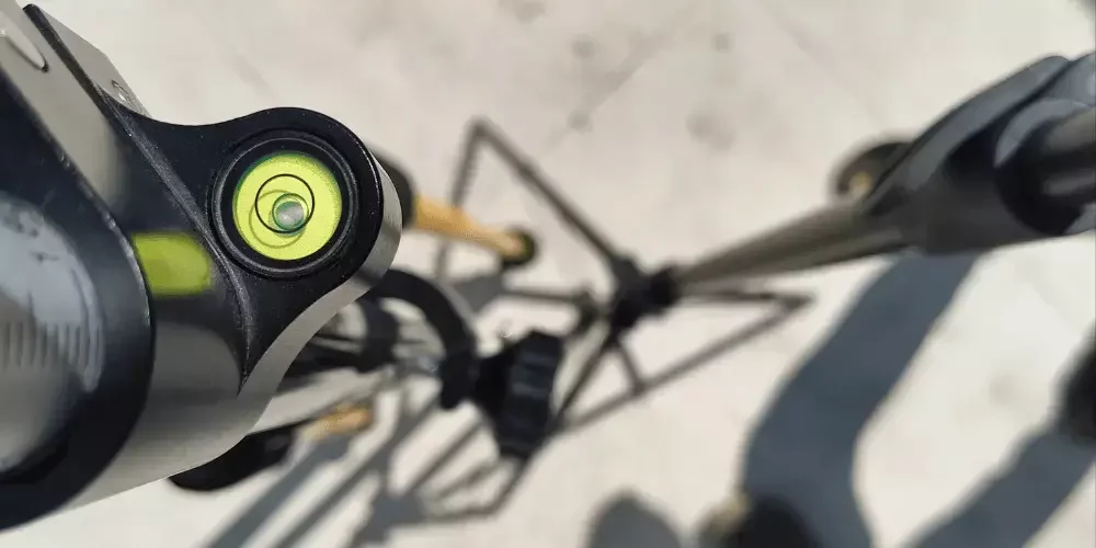 surveyor adjusting bubble during survey